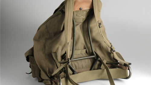 olive green canvas backpack with metal frame