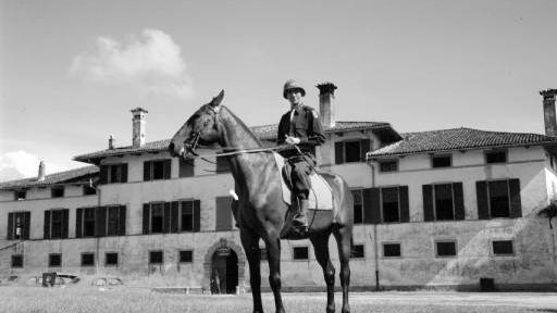 man in US army uniform on a horse