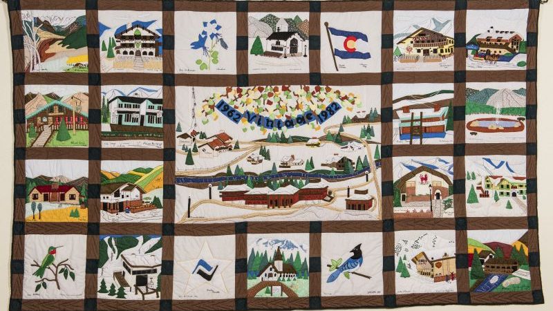 colorful quilt showing Colorado scenes